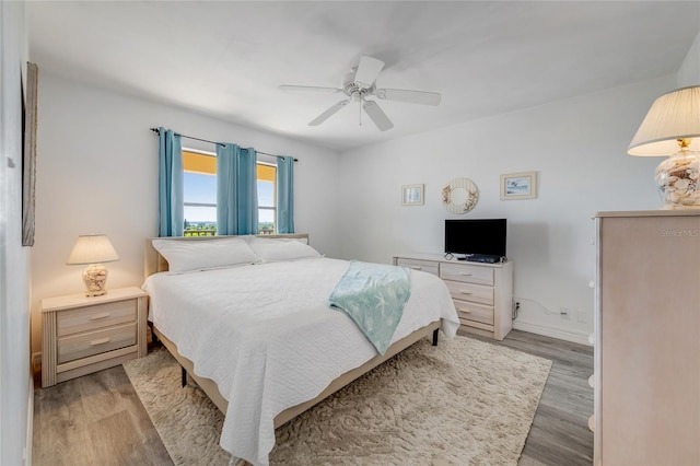 2700 Ocean Shore Blvd Unit 515, Ormond Beach, FL 32176 - bedroom featuring wood finished floors and a ceiling fan