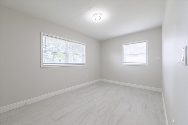 226 Palmyra Dr, Orlando, FL 32807 - unfurnished room featuring light marble finish flooring and baseboards