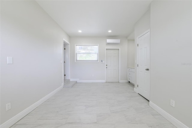 226 Palmyra Dr, Orlando, FL 32807 - hallway featuring light marble finish flooring, a wall mounted AC, and recessed lighting