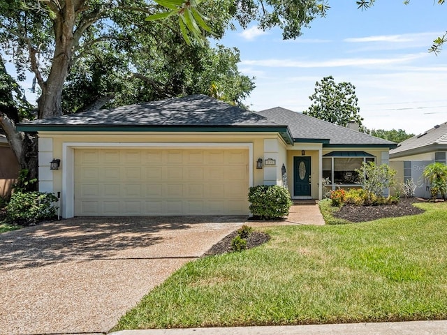 235 S Shadowbay Blvd, Longwood, FL 32779 - ranch-style house featuring concrete driveway, an attached garage, a shingled roof, a front yard, and stucco siding