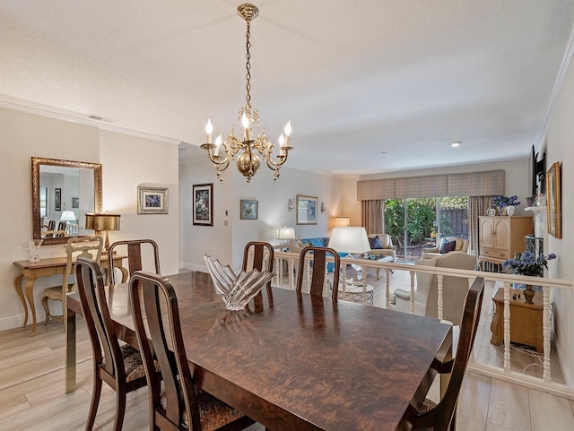 235 S Shadowbay Blvd, Longwood, FL 32779 - dining area with a chandelier, crown molding, and light wood-style floors