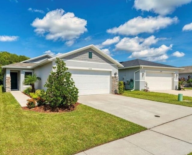 3028 Lakes Crest Ave, Saint Cloud, FL 34772 - view of front of house featuring an attached garage, driveway, stucco siding, and a front yard