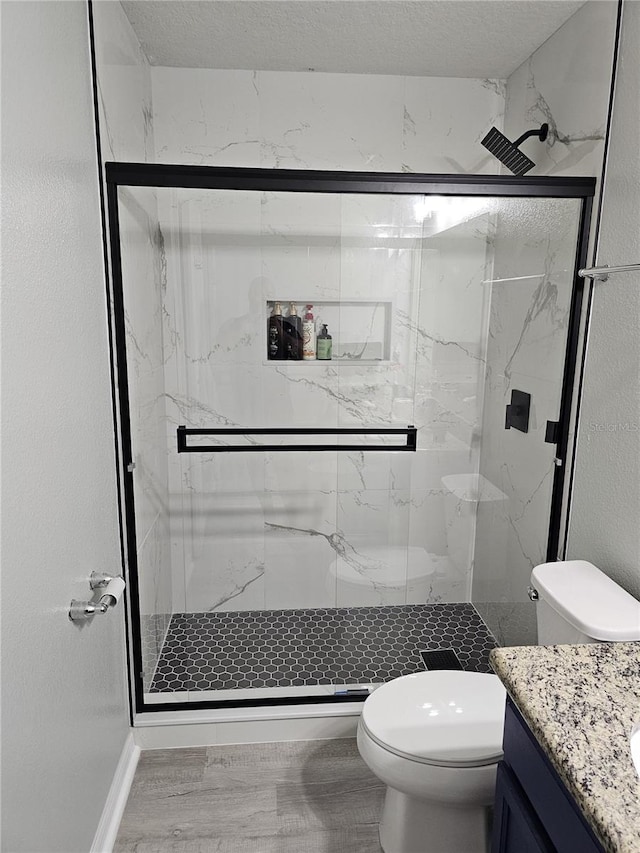3028 Lakes Crest Ave, Saint Cloud, FL 34772 - bathroom with vanity, a marble finish shower, and a textured ceiling