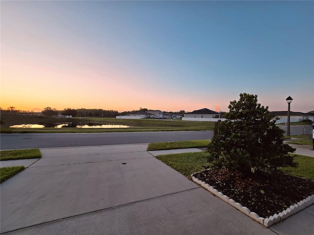 3028 Lakes Crest Ave, Saint Cloud, FL 34772 - view of concrete surface featuring street lights