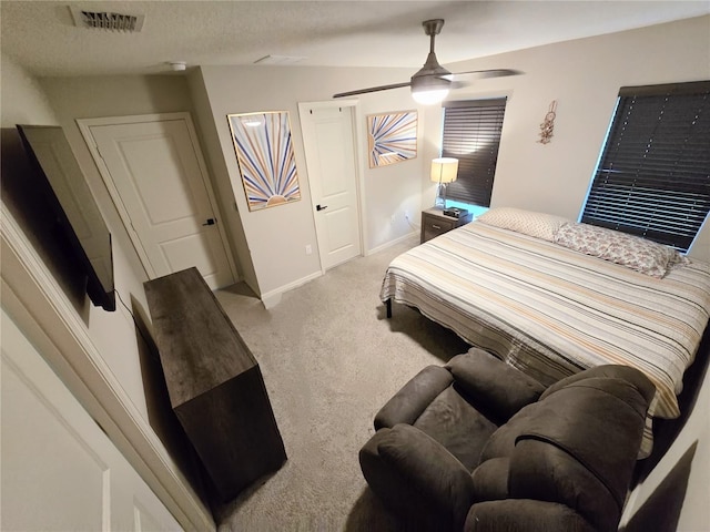 3028 Lakes Crest Ave, Saint Cloud, FL 34772 - bedroom featuring light colored carpet, ceiling fan, and a textured ceiling