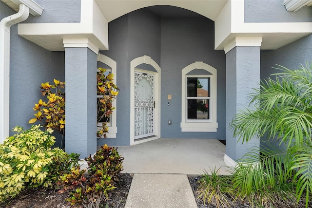 4110 Maplegrove Dr, Orlando, FL 32818 - doorway to property with stucco siding