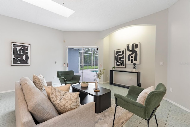 4110 Maplegrove Dr, Orlando, FL 32818 - living area featuring a skylight and light tile patterned floors