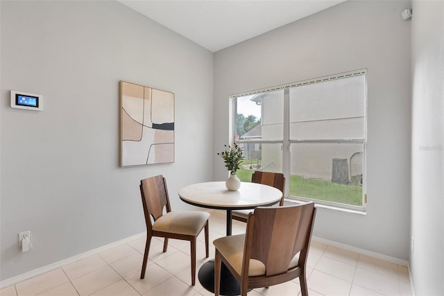 4110 Maplegrove Dr, Orlando, FL 32818 - dining space featuring baseboards and light tile patterned floors