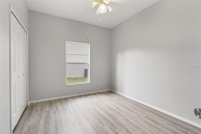 4110 Maplegrove Dr, Orlando, FL 32818 - unfurnished bedroom with wood finished floors, a closet, and a ceiling fan