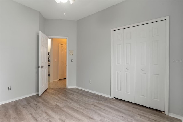 4110 Maplegrove Dr, Orlando, FL 32818 - unfurnished bedroom with light wood finished floors and a closet