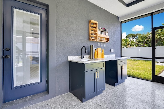 3507 W Jefferson St, Orlando, FL 32805 - indoor bar with a textured wall and dark aggregate flooring