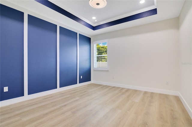 3507 W Jefferson St, Orlando, FL 32805 - empty room featuring wood finished floors, a raised ceiling, crown molding, and recessed lighting