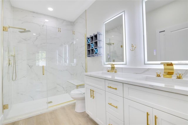 3507 W Jefferson St, Orlando, FL 32805 - bathroom featuring double vanity, a marble finish shower, and wood finished floors