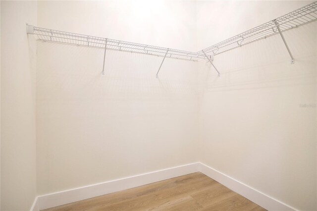 3507 W Jefferson St, Orlando, FL 32805 - spacious closet with light wood finished floors