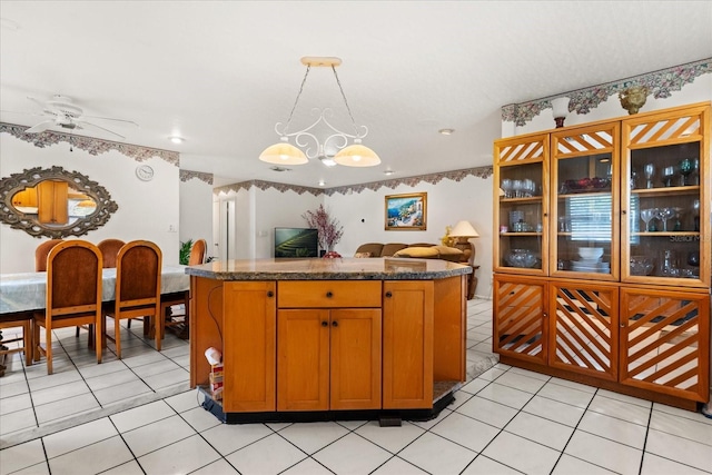 5324 Barefoot Path, Kissimmee, FL 34746 - kitchen featuring a chandelier, light tile patterned flooring, a center island, dark countertops, and recessed lighting