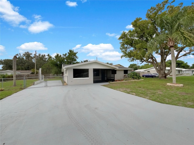 2575 King Ave, Auburndale, FL 33823 - view of front of property featuring a gate and concrete driveway
