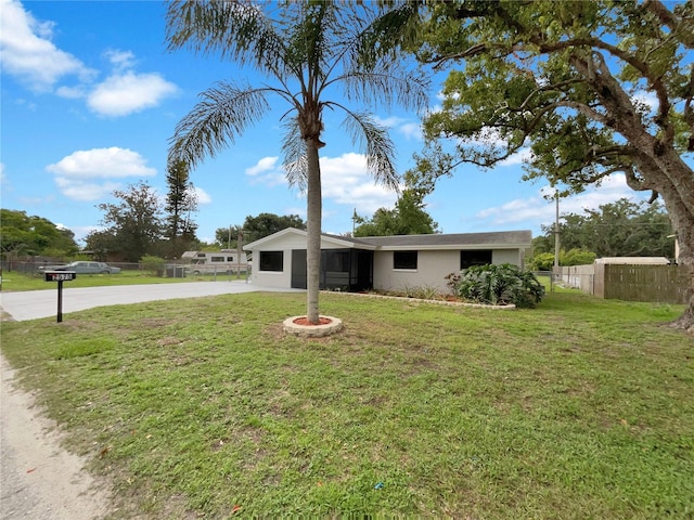 2575 King Ave, Auburndale, FL 33823 - view of front of house with concrete driveway and stucco siding