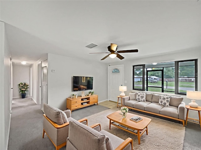 2575 King Ave, Auburndale, FL 33823 - living area featuring a ceiling fan and baseboards