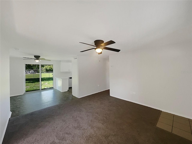 2575 King Ave, Auburndale, FL 33823 - unfurnished living room featuring a ceiling fan and dark colored carpet