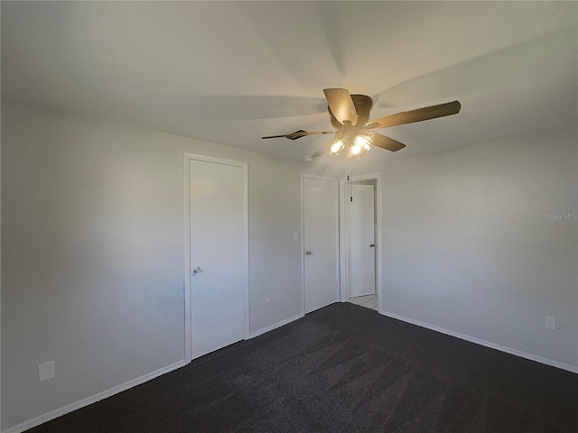 2575 King Ave, Auburndale, FL 33823 - unfurnished bedroom with dark carpet and a ceiling fan