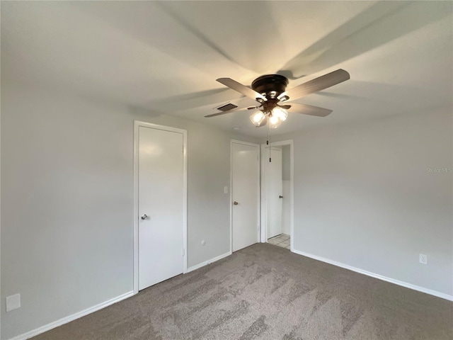 2575 King Ave, Auburndale, FL 33823 - unfurnished bedroom with carpet flooring and a ceiling fan