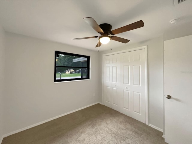 2575 King Ave, Auburndale, FL 33823 - unfurnished bedroom featuring carpet flooring, a closet, and ceiling fan