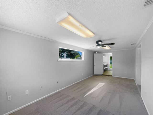 2575 King Ave, Auburndale, FL 33823 - spare room featuring a textured ceiling, ornamental molding, ceiling fan, and carpet
