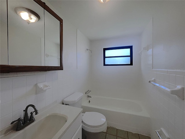 2575 King Ave, Auburndale, FL 33823 - full bath with tile walls, shower / washtub combination, vanity, and tile patterned floors