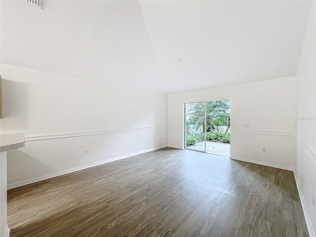 2353 Kingscrest Cir, Apopka, FL 32712 - spare room with wood finished floors and vaulted ceiling