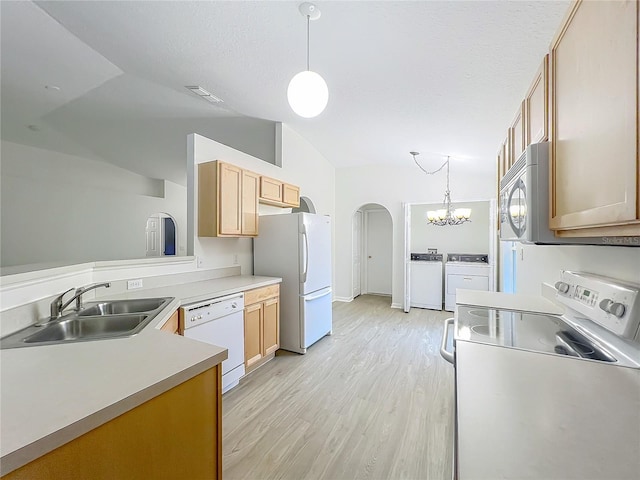 2353 Kingscrest Cir, Apopka, FL 32712 - kitchen with white appliances, arched walkways, light wood-style flooring, vaulted ceiling, and decorative light fixtures