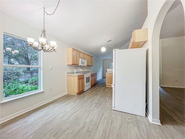 2353 Kingscrest Cir, Apopka, FL 32712 - kitchen featuring white appliances, light wood-type flooring, light countertops, arched walkways, and lofted ceiling