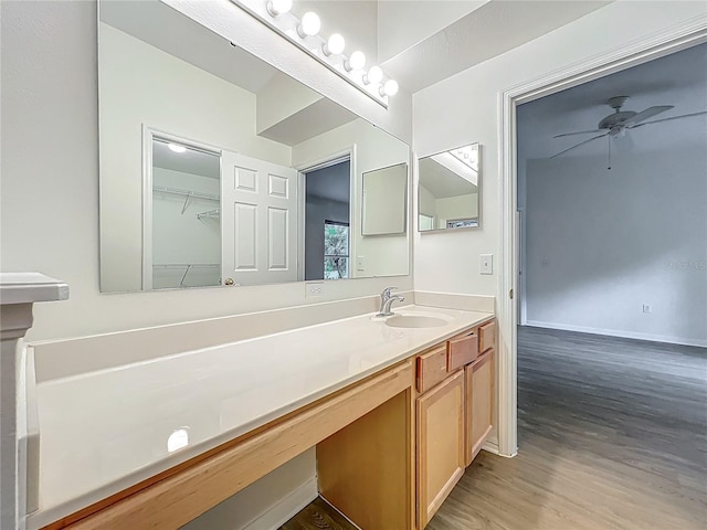 2353 Kingscrest Cir, Apopka, FL 32712 - bathroom with vanity, wood finished floors, and ceiling fan