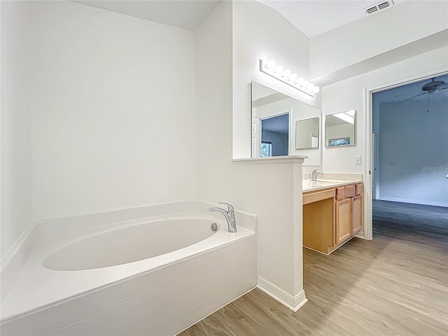 2353 Kingscrest Cir, Apopka, FL 32712 - full bath with vanity, a bath, and wood finished floors