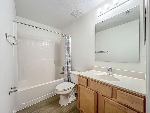 2353 Kingscrest Cir, Apopka, FL 32712 - bathroom with wood finished floors, shower / bath combo, vanity, and a textured ceiling