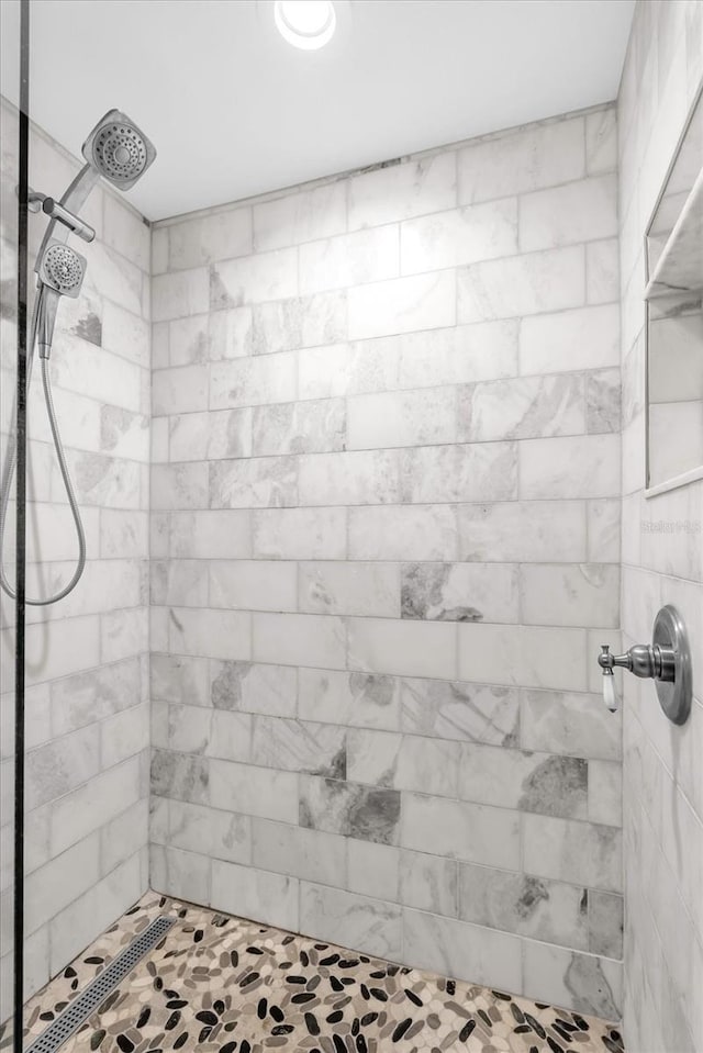 322 E Central Blvd Unit 614, Orlando, FL 32801 - bathroom featuring a tile shower