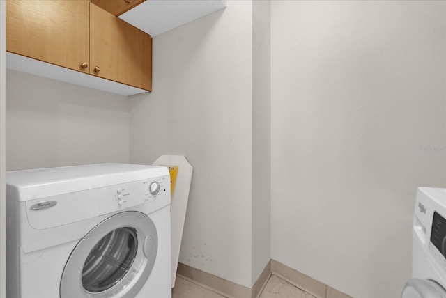 322 E Central Blvd Unit 614, Orlando, FL 32801 - washroom featuring washer / clothes dryer and cabinet space