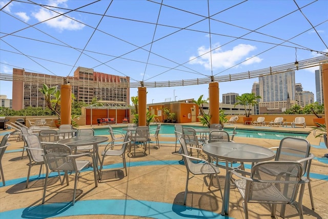 322 E Central Blvd Unit 614, Orlando, FL 32801 - view of patio / terrace with a community pool and a city view