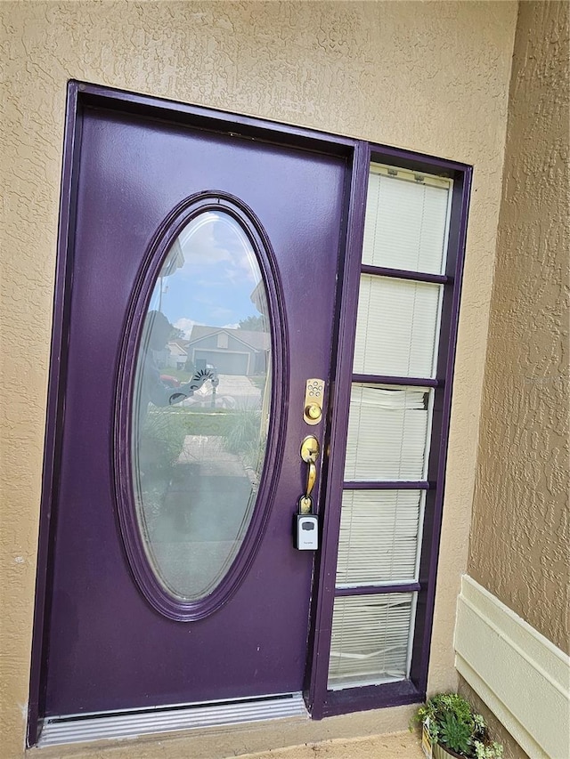 1524 Crawford Dr, Apopka, FL 32703 - view of exterior entry with stucco siding