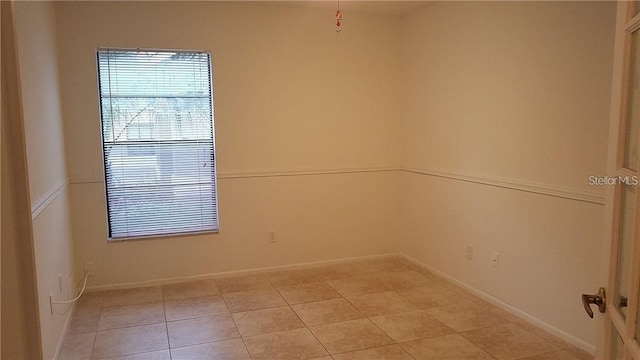 1524 Crawford Dr, Apopka, FL 32703 - empty room featuring light tile patterned flooring and baseboards
