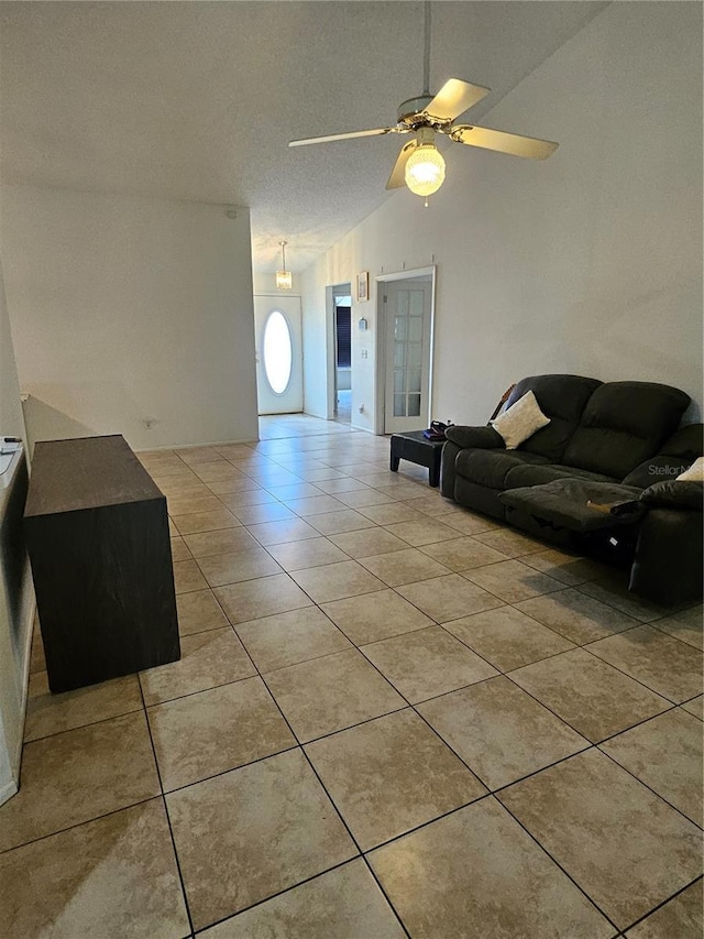 1524 Crawford Dr, Apopka, FL 32703 - living room featuring light tile patterned flooring, vaulted ceiling, and ceiling fan
