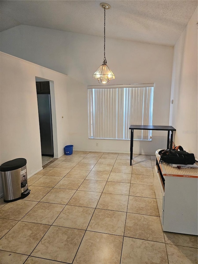 1524 Crawford Dr, Apopka, FL 32703 - dining room with lofted ceiling, light tile patterned floors, and a textured ceiling