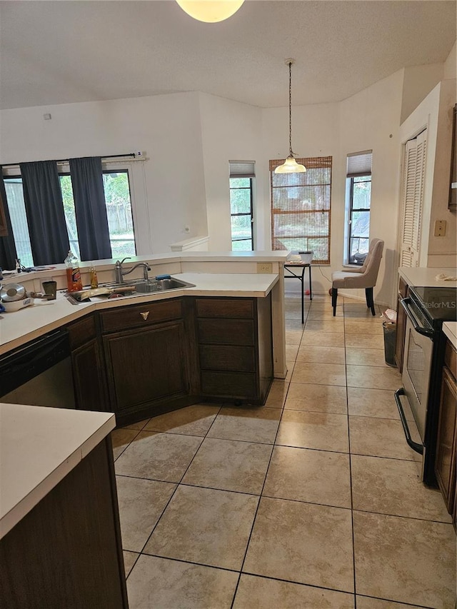 1524 Crawford Dr, Apopka, FL 32703 - kitchen featuring stainless steel appliances, light countertops, healthy amount of natural light, and light tile patterned floors