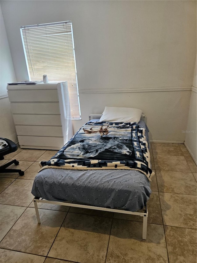 1524 Crawford Dr, Apopka, FL 32703 - bedroom featuring light tile patterned floors and baseboards