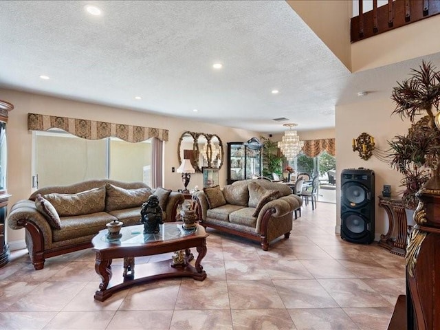 961 SW 98th Ave, Pembroke Pines, FL 33025 - living room featuring a chandelier, recessed lighting, a textured ceiling, and light tile patterned floors