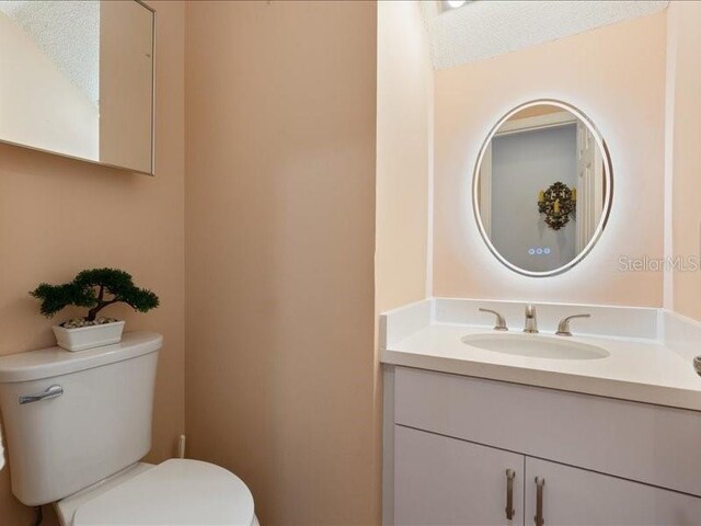 961 SW 98th Ave, Pembroke Pines, FL 33025 - half bathroom featuring vanity and a textured ceiling