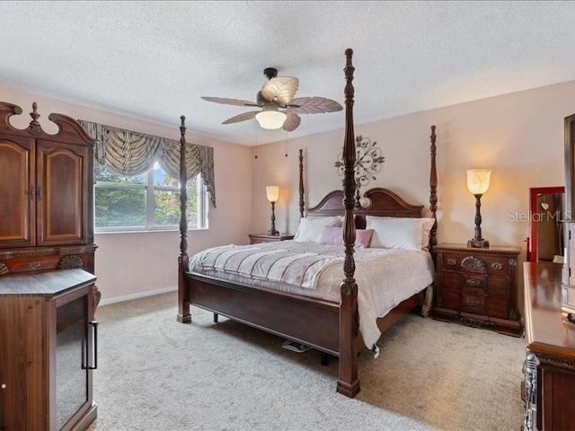 961 SW 98th Ave, Pembroke Pines, FL 33025 - bedroom featuring light colored carpet, a textured ceiling, and a ceiling fan