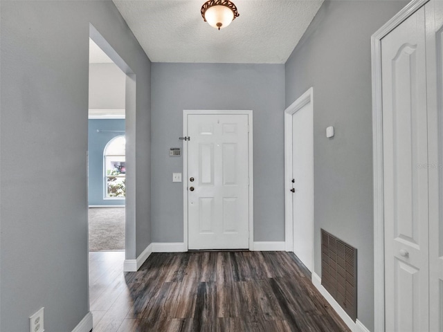 1712 Riveredge Rd, Oviedo, FL 32766 - foyer featuring dark wood-type flooring and a textured ceiling