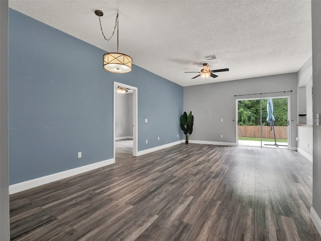 1712 Riveredge Rd, Oviedo, FL 32766 - empty room with ceiling fan, a textured ceiling, and dark wood-style floors