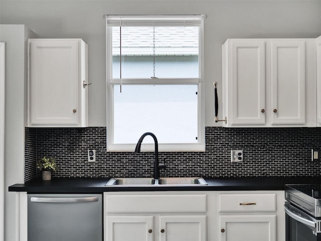 1712 Riveredge Rd, Oviedo, FL 32766 - kitchen featuring dishwasher, dark countertops, and white cabinets