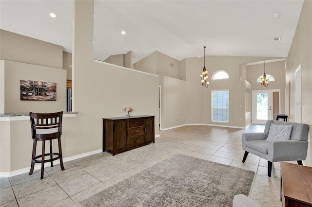 211 Tavestock Loop, Winter Springs, FL 32708 - living room featuring a chandelier, high vaulted ceiling, and light tile patterned floors